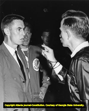 Atlanta Chiefs' Coach Woosnam and Referee Art Wachter argue on the field at a match, 1967