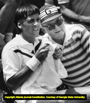 Coach Dan Magill and tennis player Mikael Pernfors talking strategy during a match, 1985