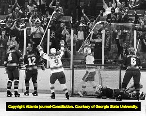 Goalie Don Edwards fails to stop a goal by the Atlanta Flames, 1980