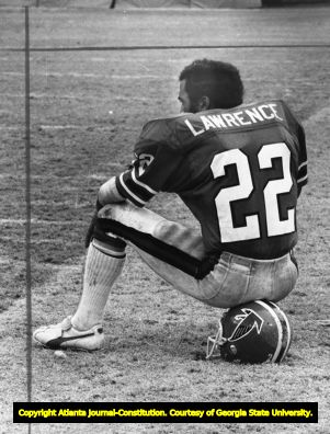 Atlanta Falcons' Rolland Lawrence rests on the sidelines, 1977