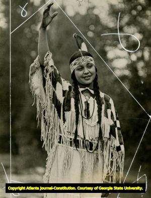 Young native American girl, dressed in full constume of the Umatillas, Confederated Tribes of the Umatilla Reservation, Oregon, 1930s?