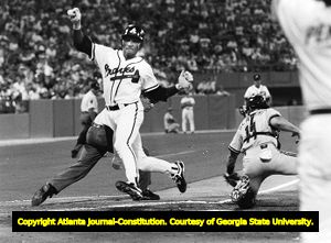 Braves Otis Nixon scores a run during a Pirates game, 1993