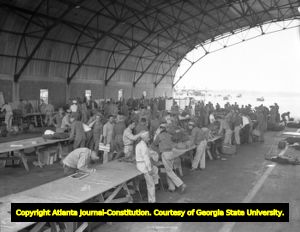Hunter Airfield hangar being used as a seperation center for returning airmen, 1945
