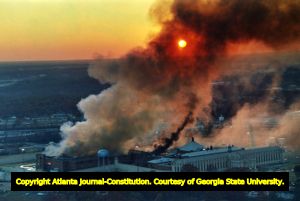 Smoke rises from the Cuban prison riots in Atlanta, 1987