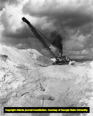 Kaolin mining equipment digs deep for clay deposits, 1956