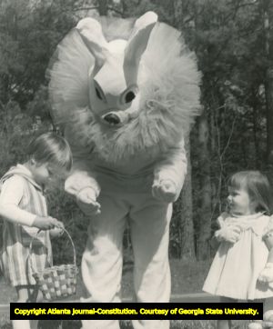Easter Bunny with two children at annual Easter egg hunt, Callaway Gardens, Pine Mountain, Georgia, 1973.