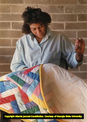 Lucy Abrams sewing a quilt as a member of the Freedom Quilting Bee, Alberta, Alabama, January 25, 1989.