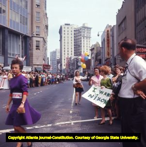 Richard Nixon supporters waiting along the campaign parade route, 1968