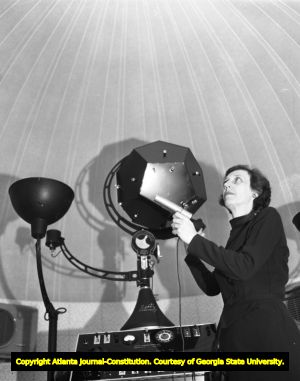 Instructor uses a Spitz Planetarium projector inside the Charles and Bessie Goodman Planetarium, 1954