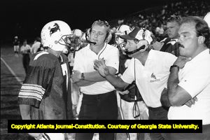 Coach Dave Hunter talking to the Brookwood Broncos' quarterback Mickey Haynes, 1987