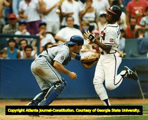 Atlanta Braves Francisco Cabrera scores the winning run against the Chicago Cubs, 1990
