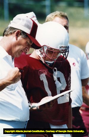 Brookwood coach Dave Hunter and quarterback Cory Brown discuss plans for season opener, 1991