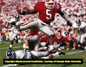 Bulldogs' Garrison Heast leaps over Georgia Southern to score a touchdown, 1992