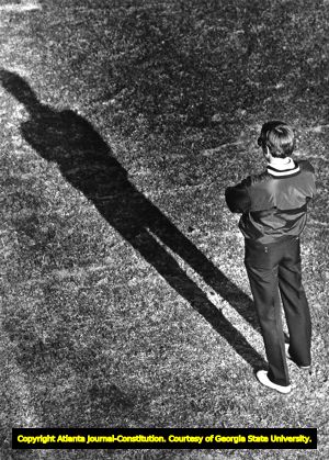Coach Bill Curry watches his team during the first day of spring practice, circa 1980s
