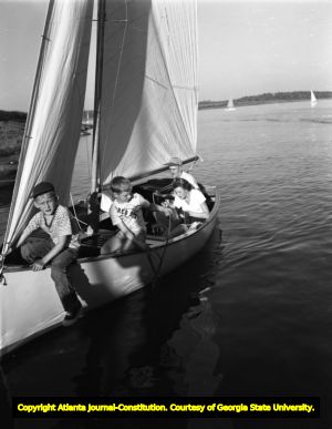 Family sailing on Lake Allatoona, 1950