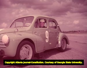 Woman racer in her Renault sports car, 1957