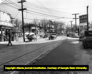Storefronts and automobiles along Ponce de Leon, circa 1930s