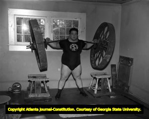Weightlifter Paul Anderson training in his home gym, 1955