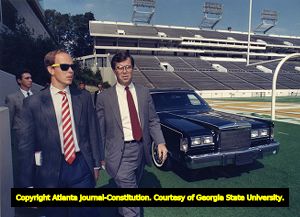 A.O.C president Billy Payne gives the Prince of Monaco a tour of Georgia Tech's stadium, 1989