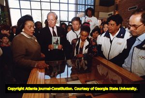 Coretta Scott King gives I.O.C. members a tour of the Martin Luther King Center, 1990