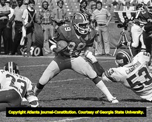Falcons' Wallace Francis dodges New York Giants' Harry Carson in the open field, 1978