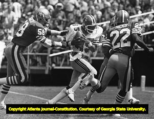 Falcons' Alfred Jackson catches a pass surrounded by San Francisco 49ers, 1981