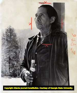 Portrait photograph of Cherokee medicine man Amoneeta Sequoyah holding Pepsi-Cola bottle, 1970.