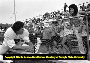 Falcons' Mick Luckhurst chats with admiring fans during a scrimmage, 1984