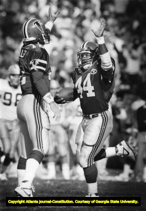 Atlanta Falcons' John Settle celebrates with Chris Miller after scoring a one yard touchdown, 1988