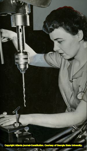 World War II women in industry: Woman at a drill press in an airplane factory, April 1943.