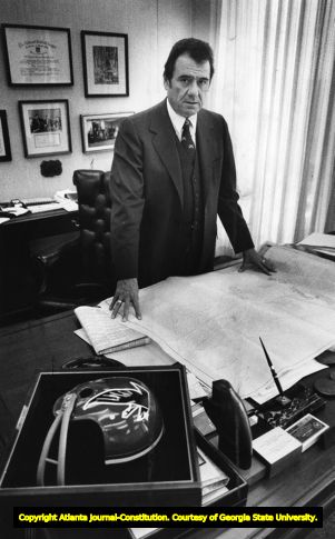 Rankin Smith with plans for a new Falcons training facility, 1978