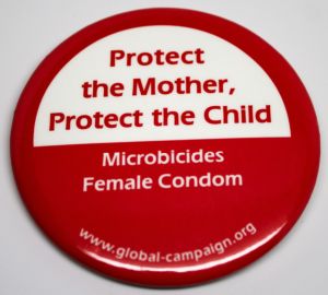 Protect the Mother, Protect the Child, Microbicides Female Condom [button], circa 2000s