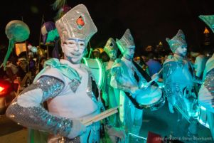 A group of drummers dresses for the parade march by