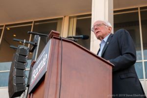 Bernie Sanders gives a speech from a podium