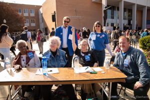 Supporters of Sanders sit gathered at a table