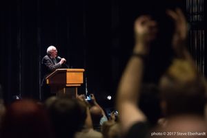 Bernie Sanders speaks to a crowd while at an event to promote his new book