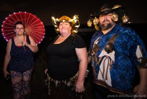 A group of people with decorated hats and umbellas