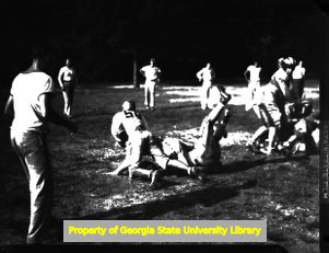 High school football game at night, Atlanta, Georgia, circa late 1930s or early 1940s