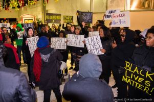 Protestors gather within the CNN Center