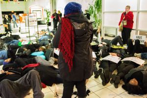 Protestors partake in a die-in at the CNN Center