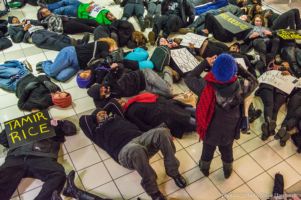 Protestors partake in a die-in at the CNN Center
