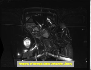 Wrecked car at night, Atlanta, Georgia, circa late 1930s or early 1940s