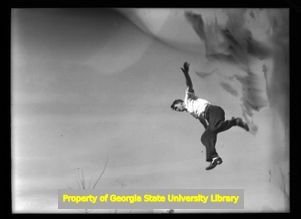 Jumping into the Georgia Marble Company quarry, Tate, Georgia, circa late 1930s or early 1940s