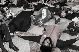 Protesters lay outside of the Fox as part of a staged die-in protest