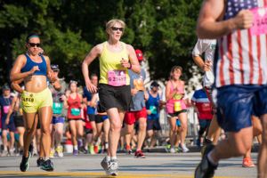 An older participant in the race runs through the race