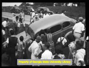A car that has run off the the road, Atlanta, Georgia, circa late 1930s or early 1940s
