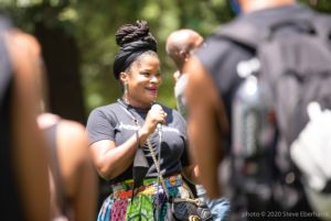 A protester uses a microphone to speak to the crowd