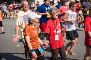 Participants walk along as they continue the race