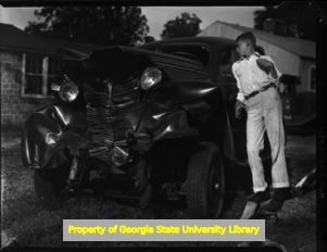 Wrecked car on Bankhead Highway, Atlanta, Georgia, circa late 1930s or early 1940s