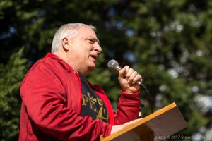 A protester uses a microphone to give a speech